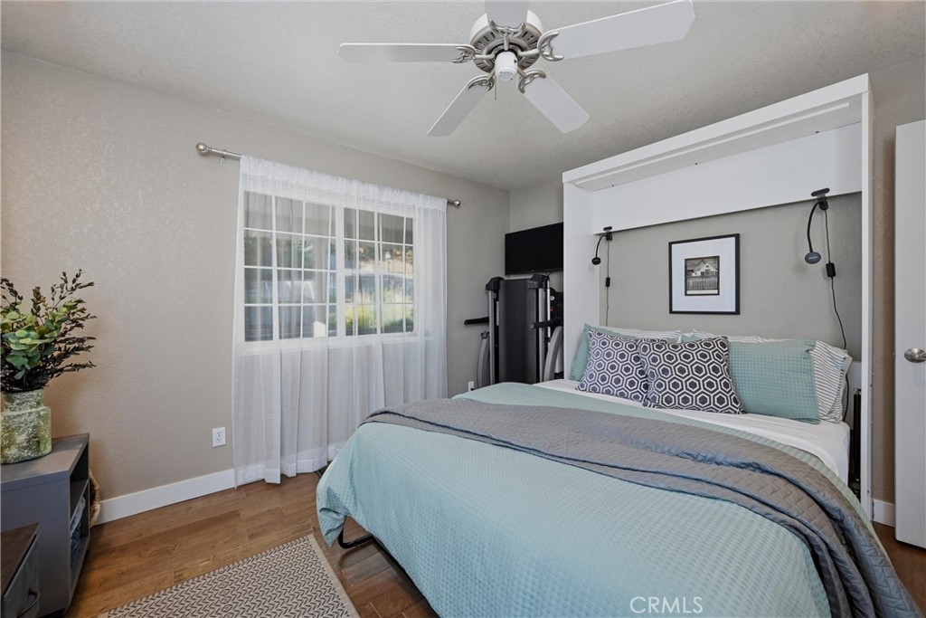 17432 Greenridge Road Hidden Valley Lake, CA 95467 - Photo 40 of 72 a bedroom with a large bed and a window