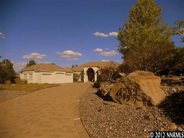 4585 Mountaingate Drive Reno, NV 89519 - Photo 1 of 1 a view of a road with a building in the background