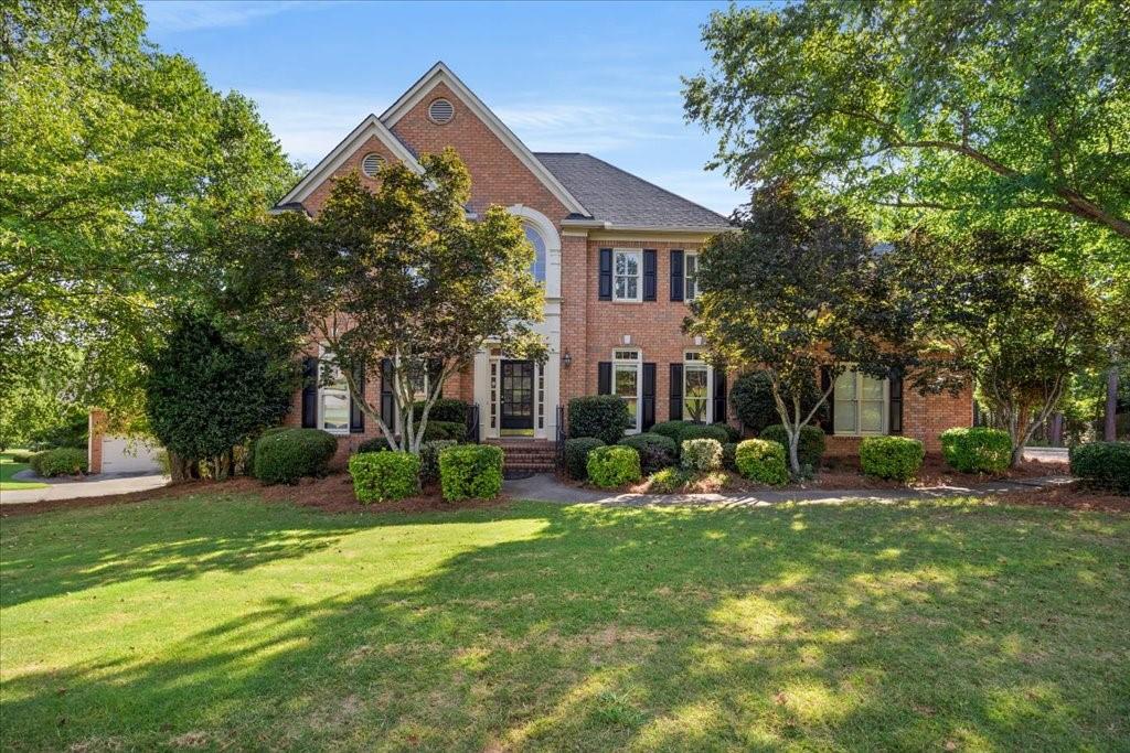 1070 Montclair Way Snellville, GA 30078 - Photo 1 of 1 a view of a house with a yard and tree s