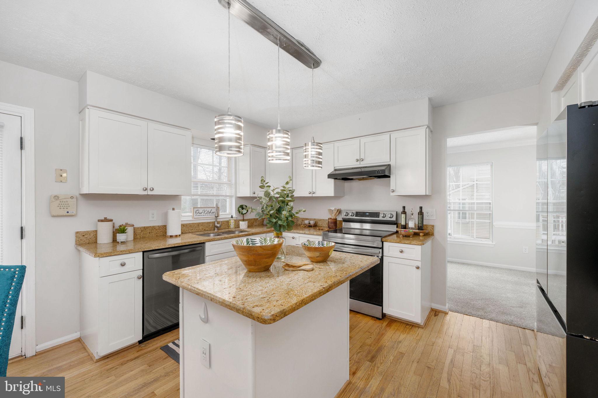 73 Spring Lake Drive Stafford, VA 22556 - Photo 16 of 71 a kitchen with stainless steel appliances granite countertop a sink stove and refrigerator