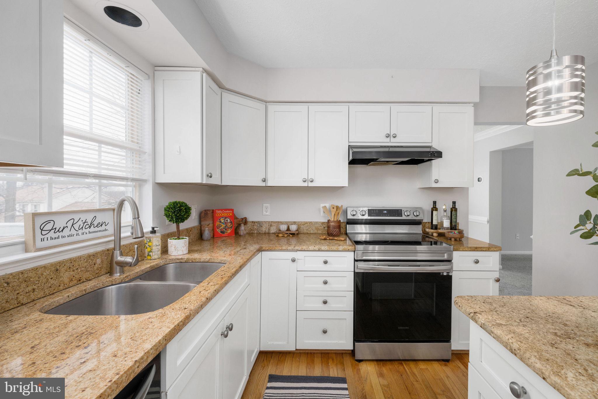 73 Spring Lake Drive Stafford, VA 22556 - Photo 18 of 71 a kitchen with granite countertop a sink stove and cabinets