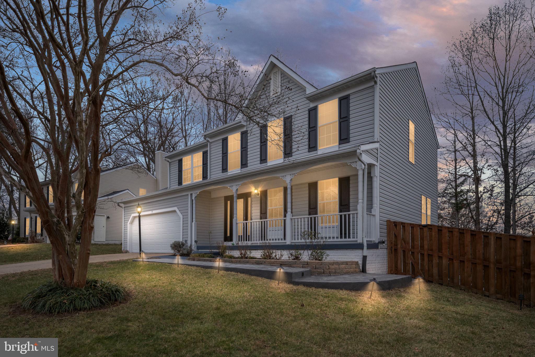 73 Spring Lake Drive Stafford, VA 22556 - Photo 2 of 71 a front view of a house with a yard table and chairs