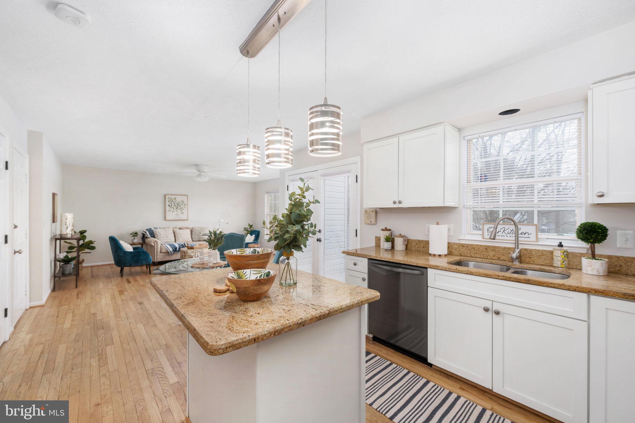 73 Spring Lake Drive Stafford, VA 22556 - Photo 21 of 71 a kitchen with a white cabinets and chandelier