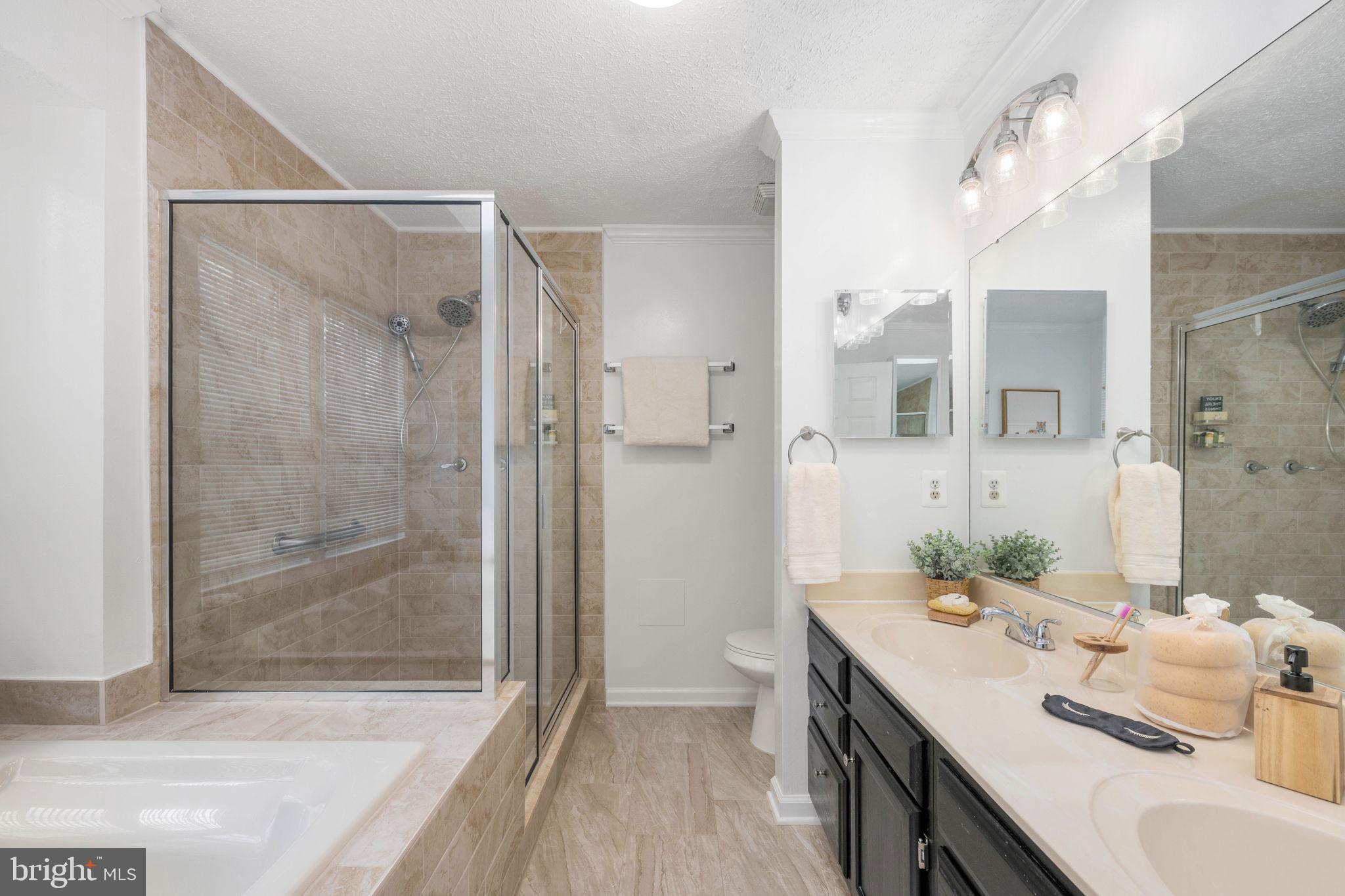 73 Spring Lake Drive Stafford, VA 22556 - Photo 38 of 71 a bathroom with a granite countertop sink a shower and a mirror