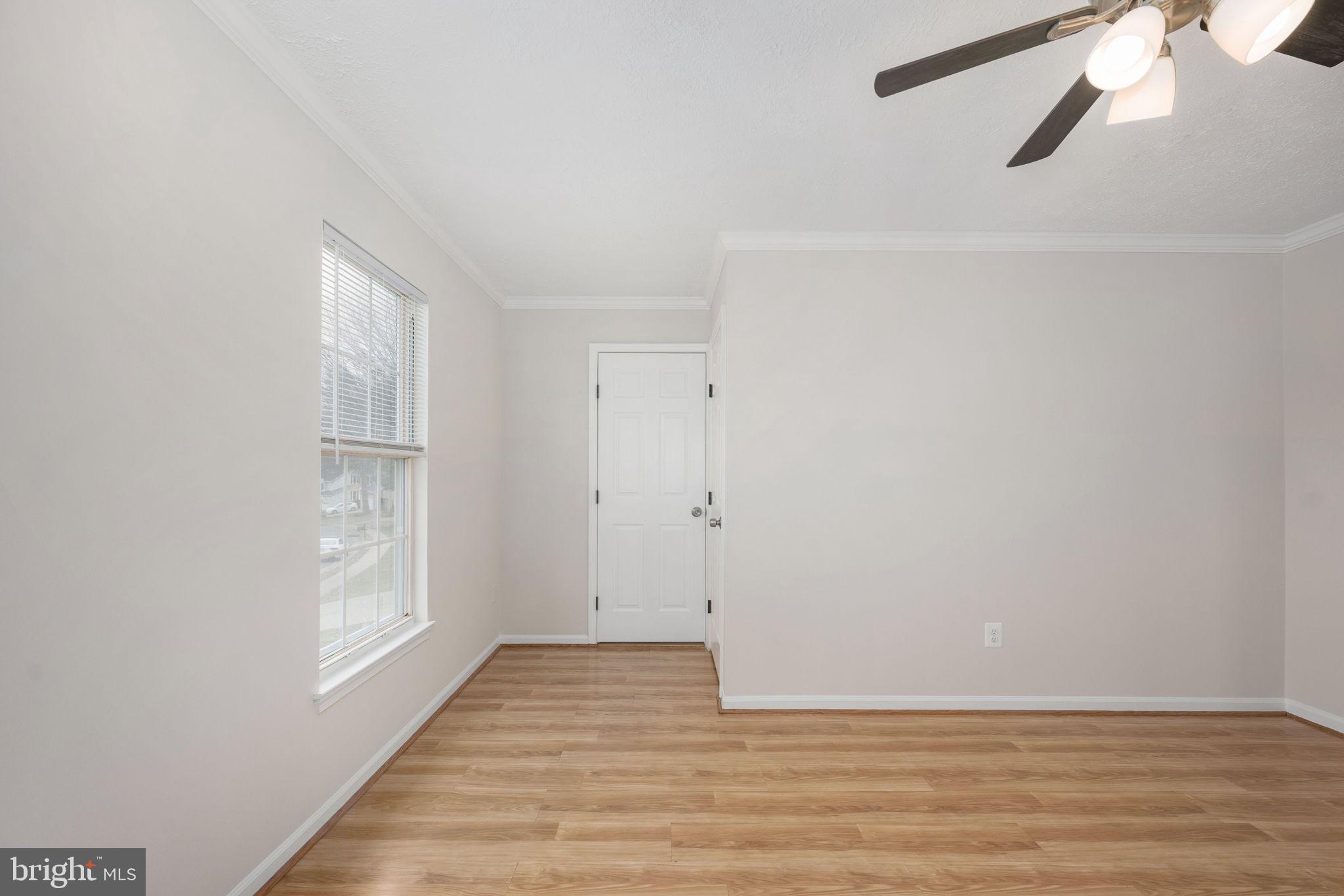 73 Spring Lake Drive Stafford, VA 22556 - Photo 43 of 71 a view of an empty room with wooden floor and a window
