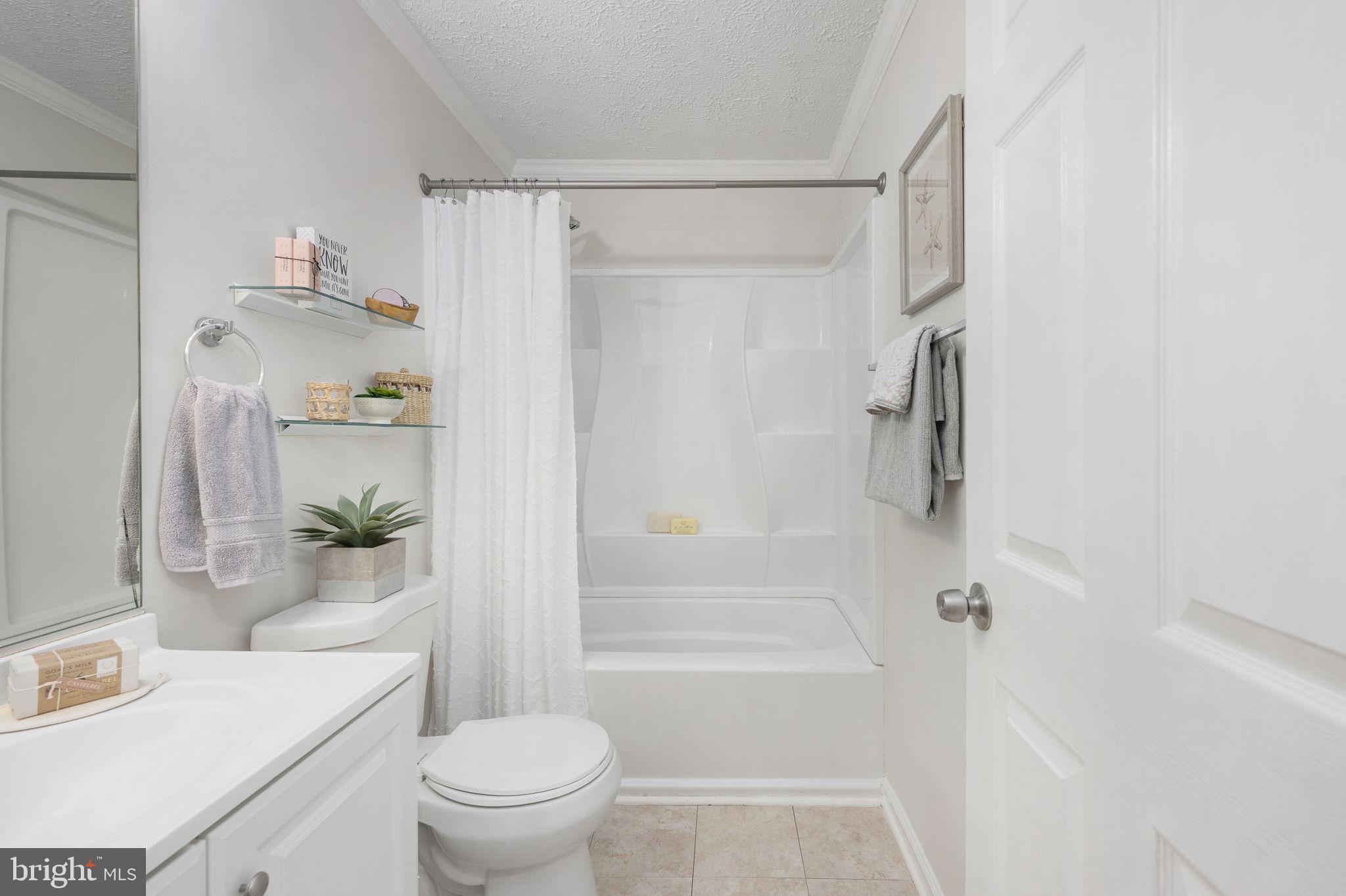 73 Spring Lake Drive Stafford, VA 22556 - Photo 44 of 71 a bathroom with a shower a toilet and a shower