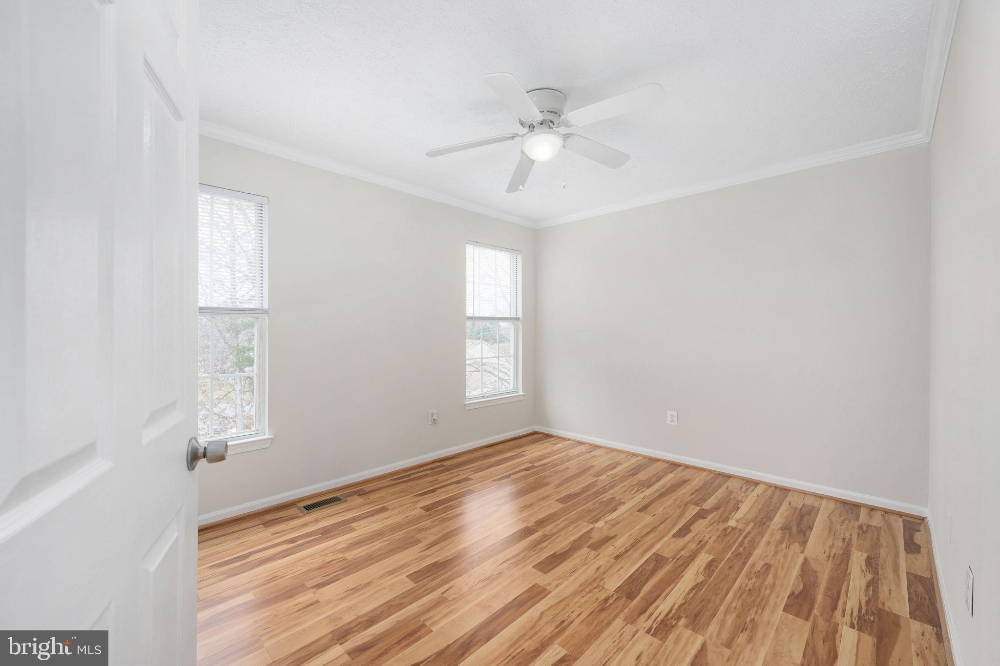 73 Spring Lake Drive Stafford, VA 22556 - Photo 46 of 71 a view of an empty room with wooden floor and a window