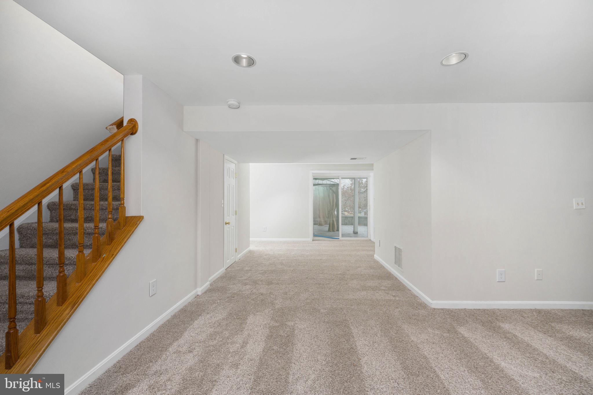 73 Spring Lake Drive Stafford, VA 22556 - Photo 49 of 71 a view of an empty room with wooden floor