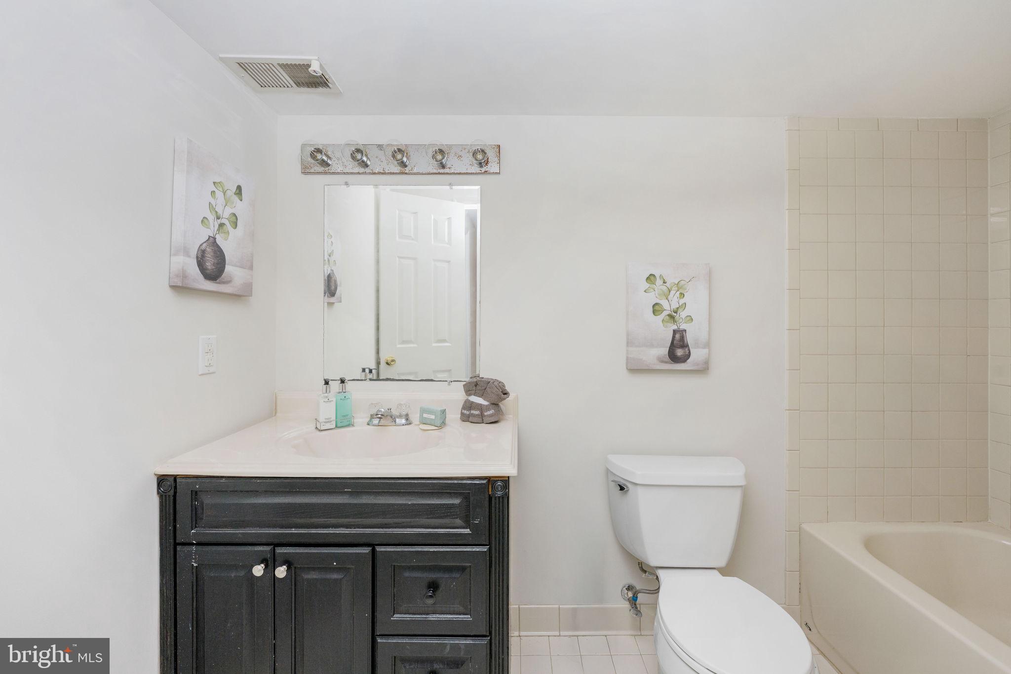73 Spring Lake Drive Stafford, VA 22556 - Photo 55 of 71 a bathroom with a sink toilet and shower