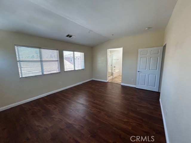 1911 Cefalu Court Riverside, CA 92507 - Photo 11 of 42 an empty room with wooden floor and windows