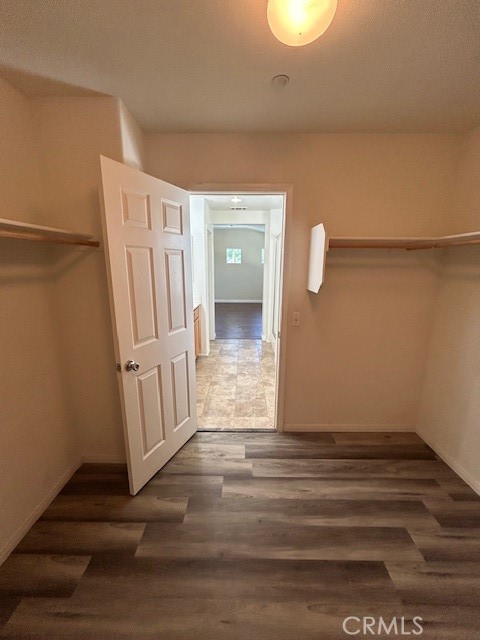 1911 Cefalu Court Riverside, CA 92507 - Photo 16 of 42 a view of a room with wooden floor and white walls