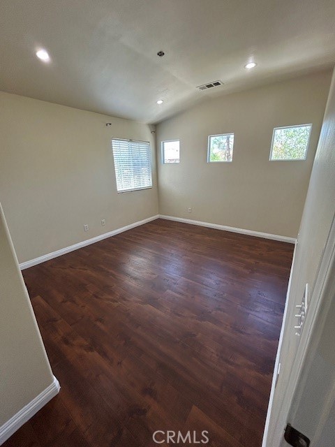1911 Cefalu Court Riverside, CA 92507 - Photo 18 of 42 an empty room with wooden floor and windows