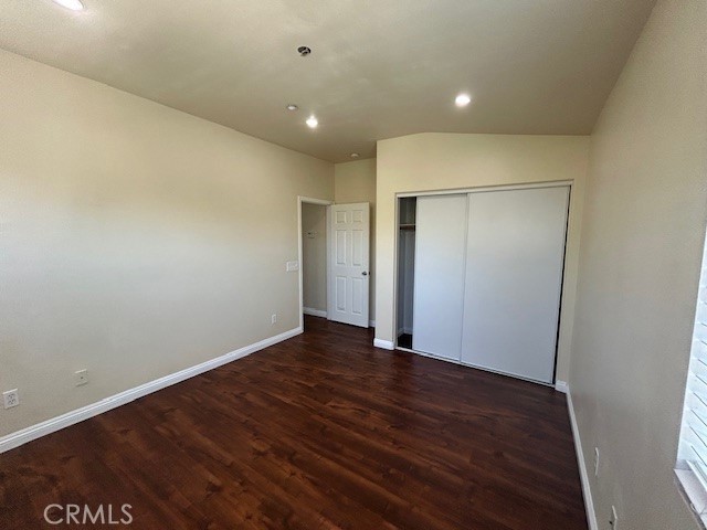 1911 Cefalu Court Riverside, CA 92507 - Photo 19 of 42 a view of an empty room with wooden floor