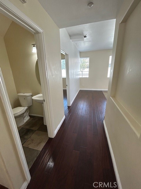 1911 Cefalu Court Riverside, CA 92507 - Photo 21 of 42 a view of a hallway with wooden floor and stairs