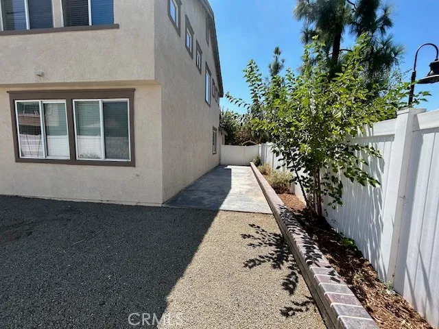 a view of a backyard with pathway