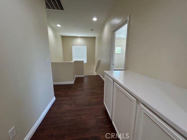 1911 Cefalu Court Riverside, CA 92507 - Photo 38 of 42 a view of hallway with wooden floor