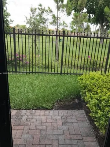 a view of a garden with a lake view