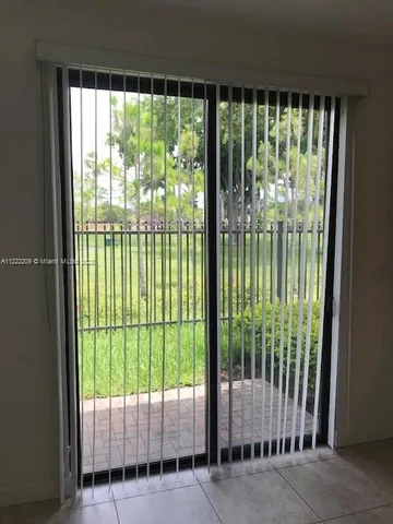 a view of a large window with an outdoor space