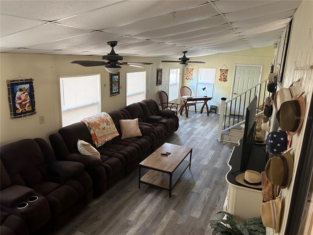 55624 Sam Street Astor, FL 32102 - Photo 11 of 12 a living room with furniture and wooden floor