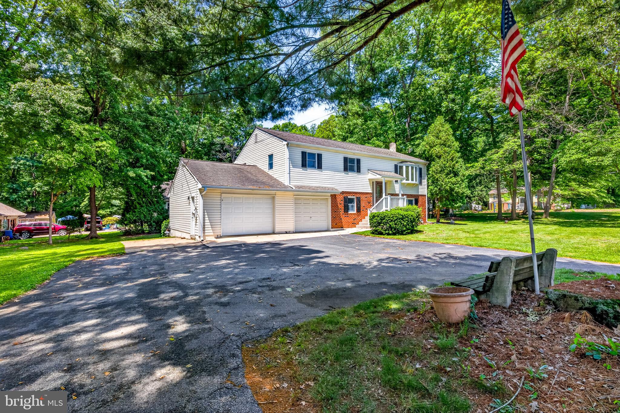 3701 Ebright Road Chadds Ford, PA 19317 - Photo 44 of 45 a front view of a house with a yard and garage