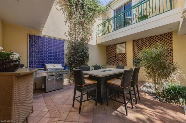 a view of a dinning table and chairs in the patio