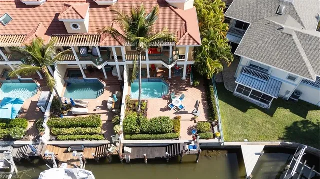 an aerial view of a house with a ocean view
