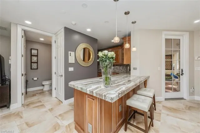 a living room with a table and chairs