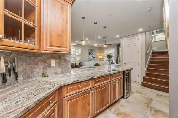 a kitchen with sink and cabinets