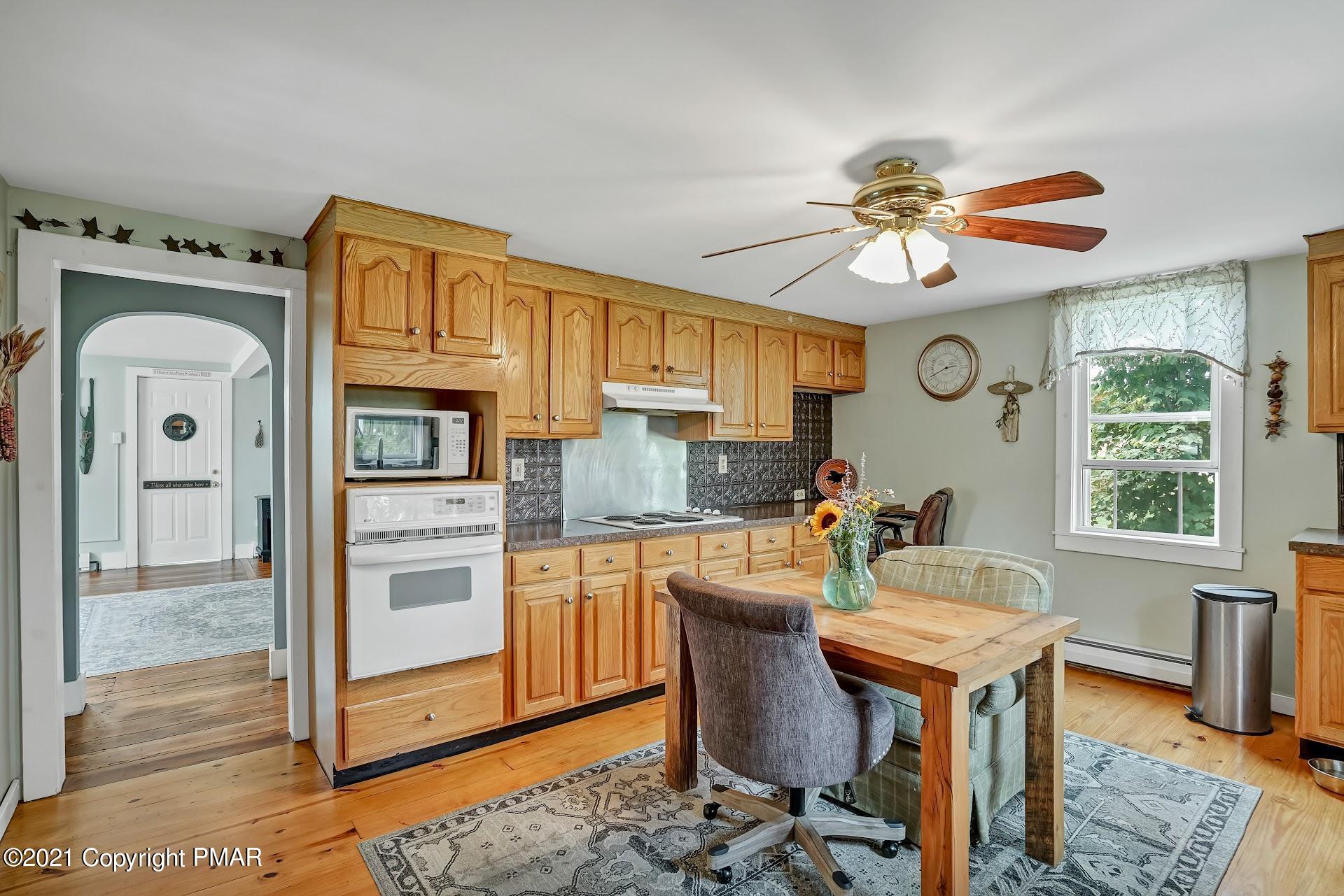 1186 Burger Hollow Road Effort, PA 18330 - Photo 11 of 35 a view of a dining room with furniture window and wooden floor