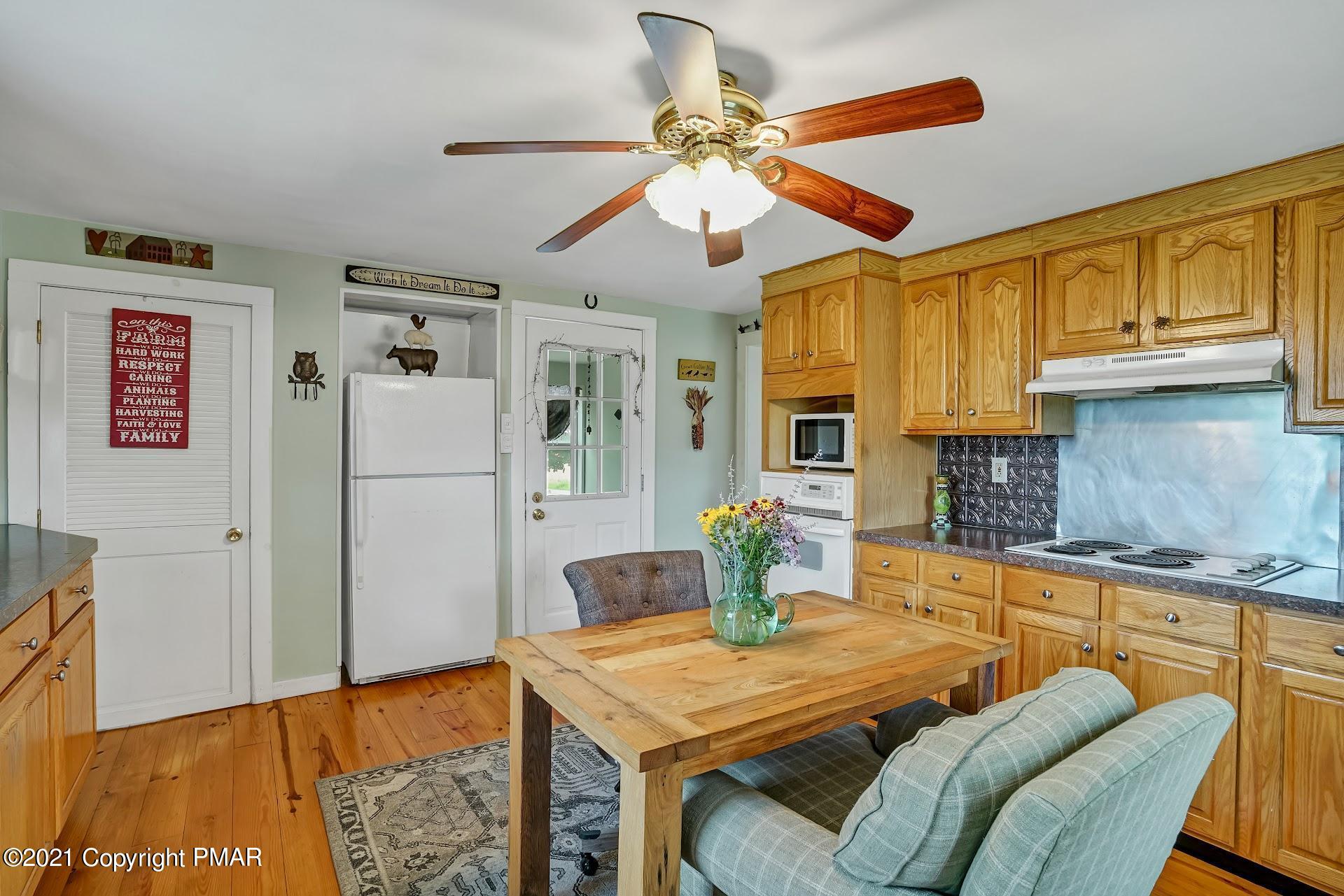 1186 Burger Hollow Road Effort, PA 18330 - Photo 12 of 35 a view of a dining room with furniture and wooden floor