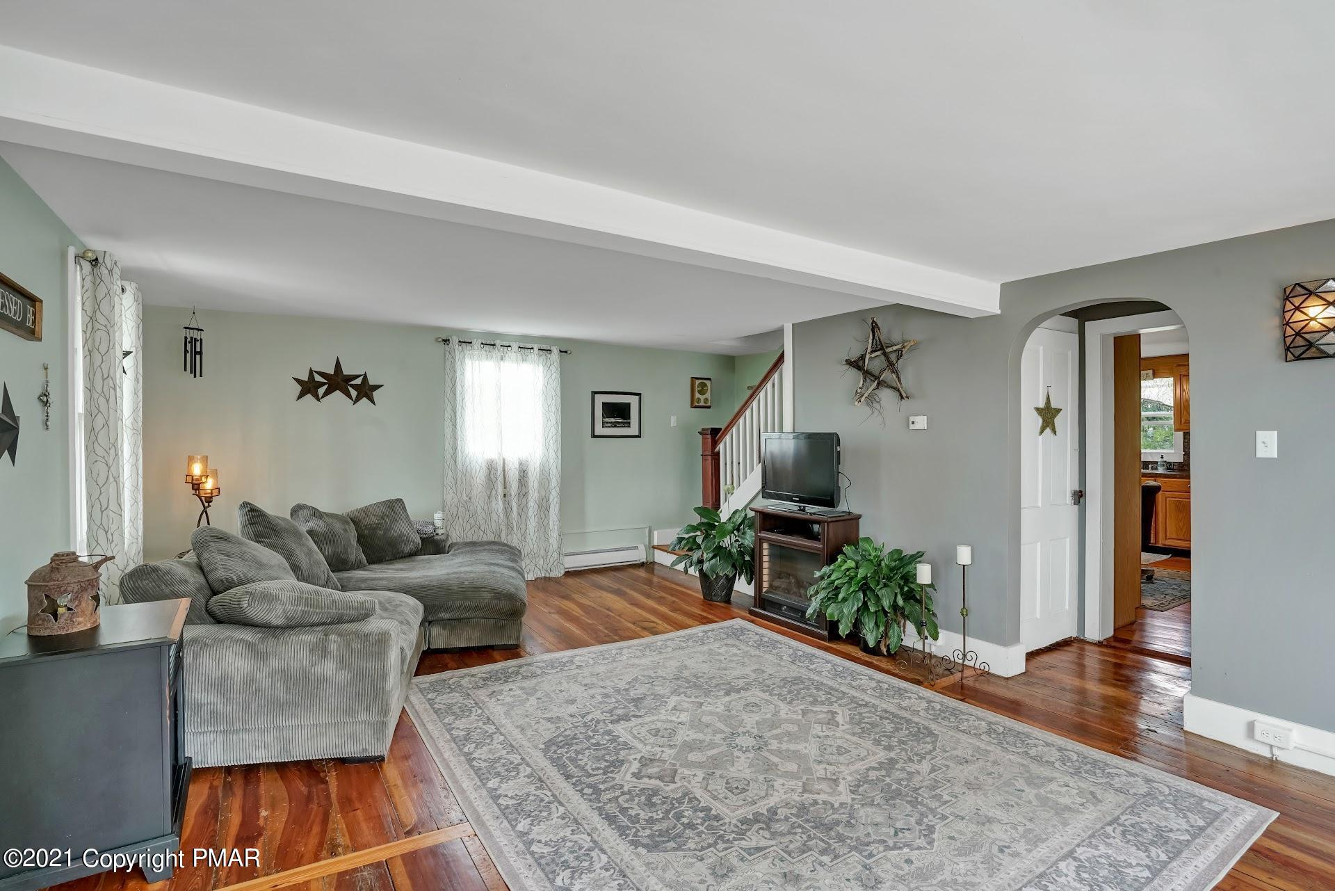 1186 Burger Hollow Road Effort, PA 18330 - Photo 14 of 35 a living room with furniture and a wooden floor