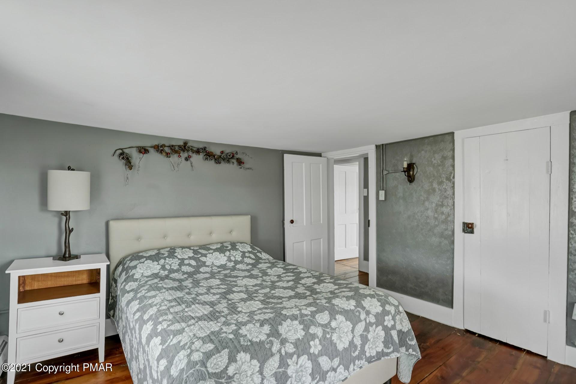 1186 Burger Hollow Road Effort, PA 18330 - Photo 17 of 35 a bedroom with a bed and a window