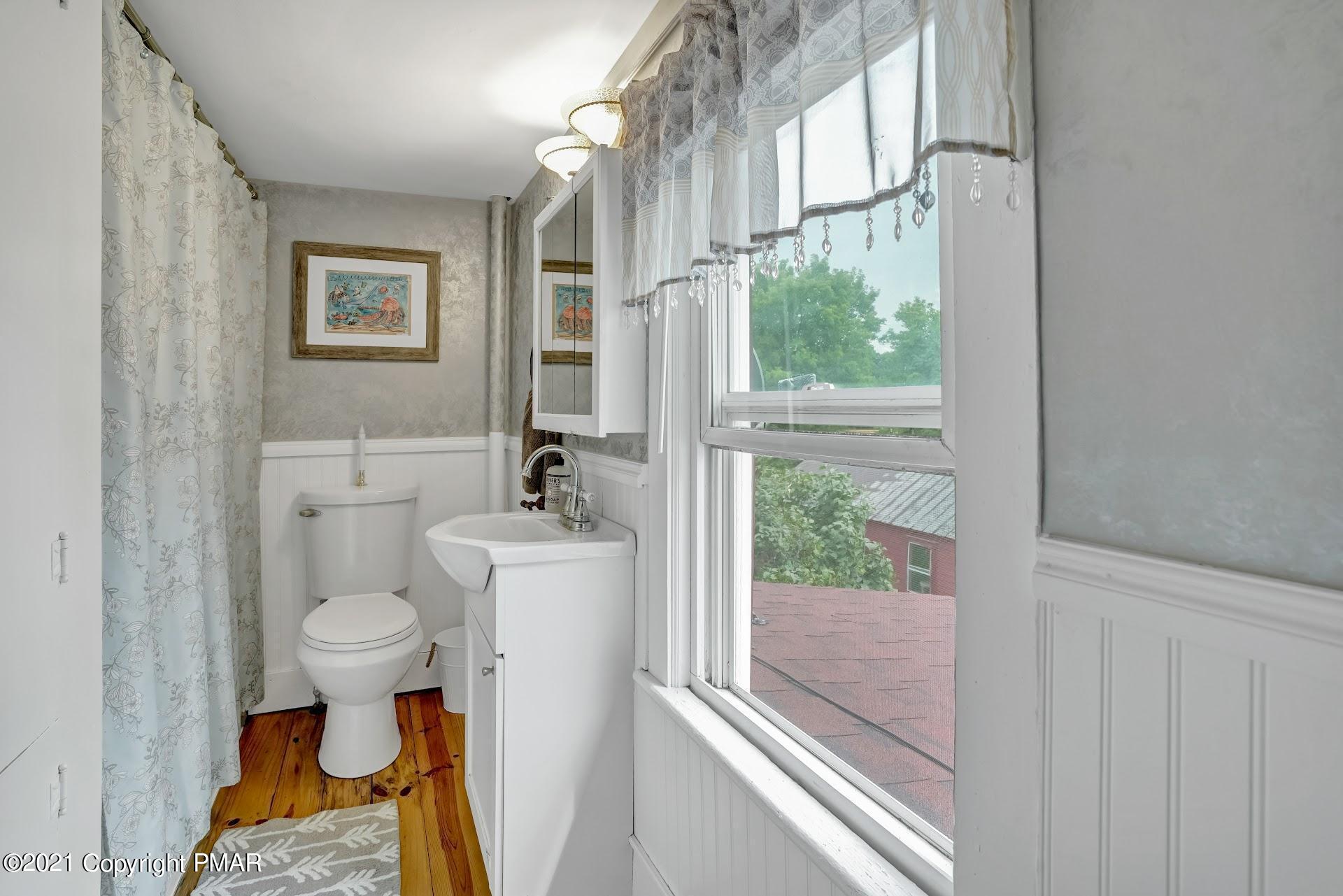 1186 Burger Hollow Road Effort, PA 18330 - Photo 20 of 35 a bathroom with a toilet sink and tub