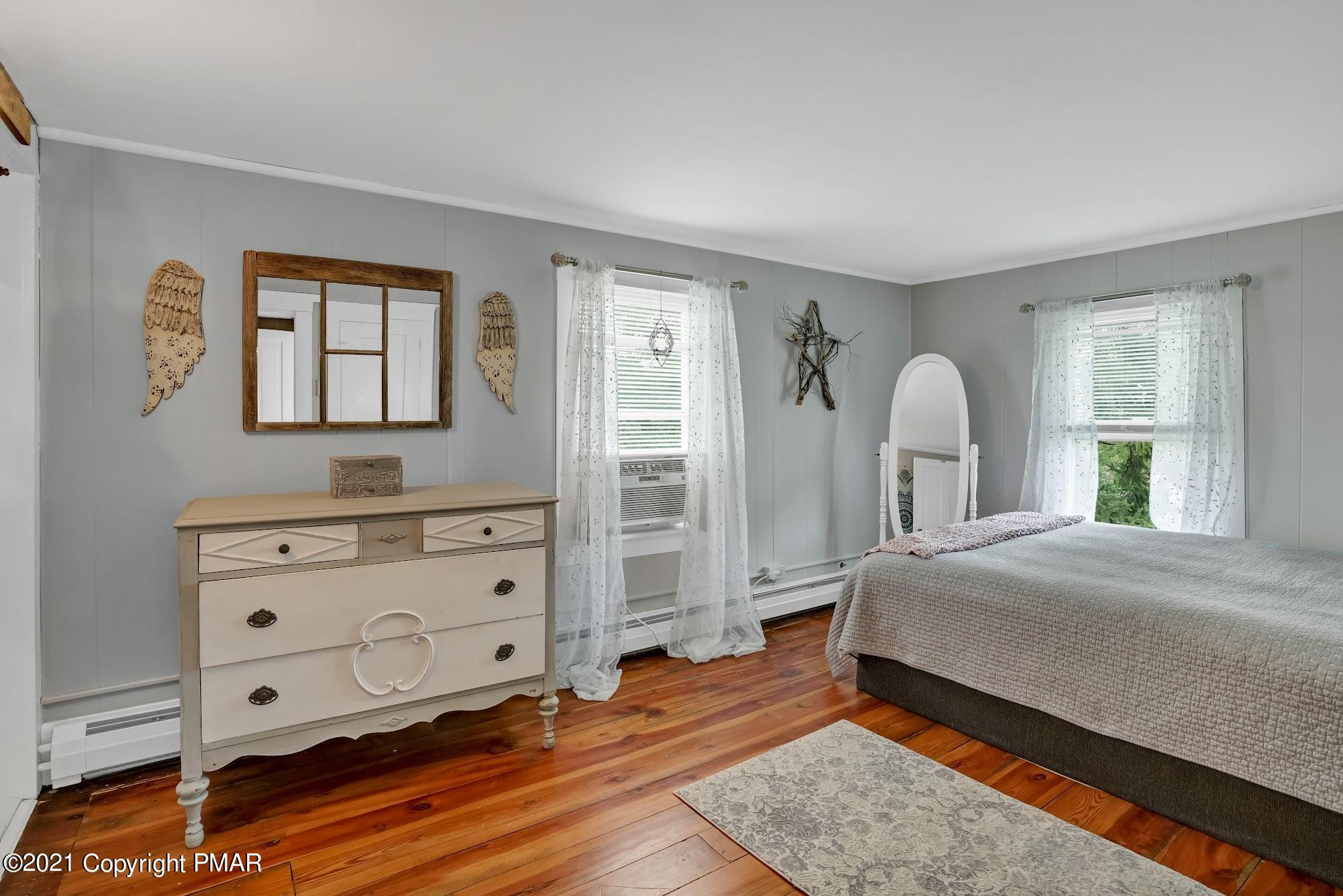 1186 Burger Hollow Road Effort, PA 18330 - Photo 22 of 35 a bedroom with a bed and a dresser