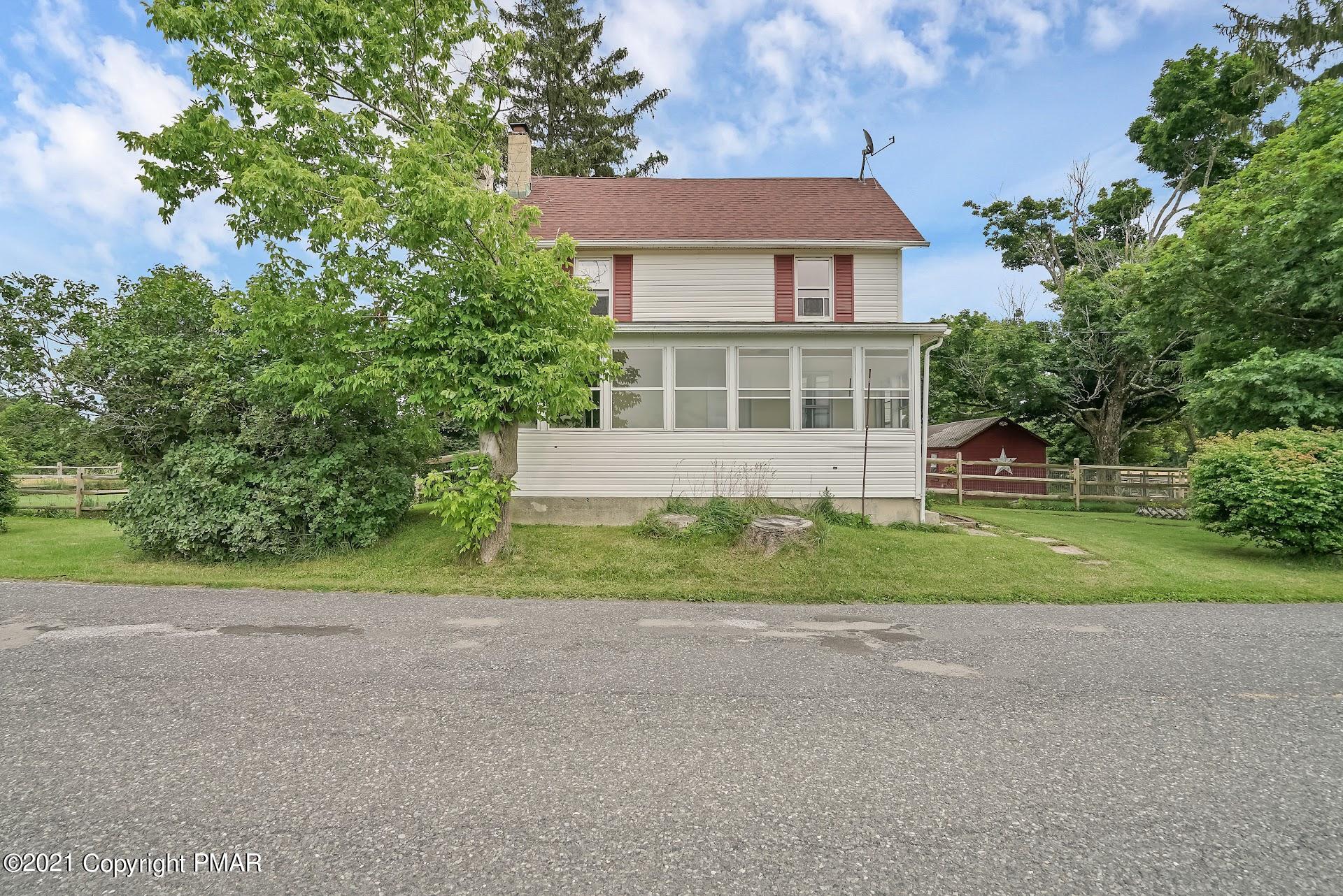 1186 Burger Hollow Road Effort, PA 18330 - Photo 35 of 35 a front view of a house with a yard and trees