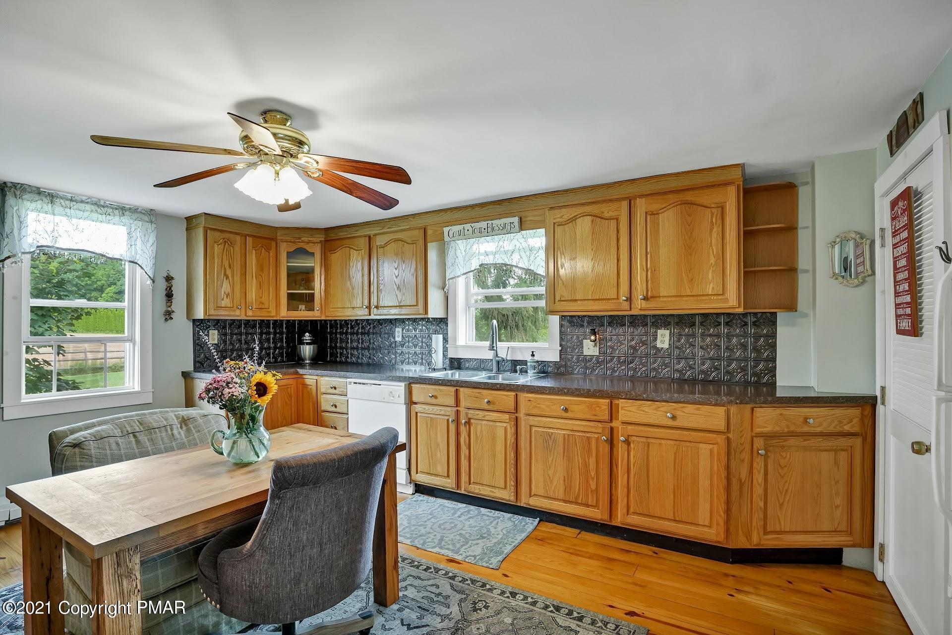 1186 Burger Hollow Road Effort, PA 18330 - Photo 10 of 35 a dining room with granite countertop furniture and wooden floor