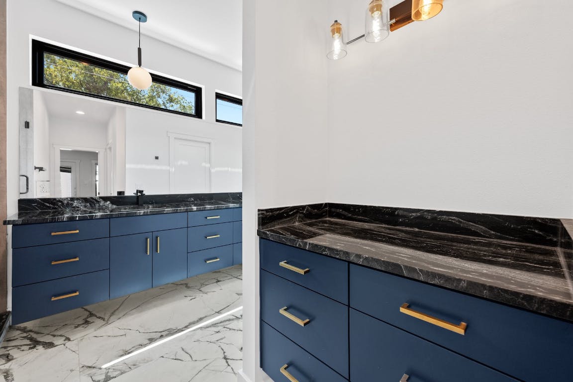 7008 Meador Avenue, Unit 1 Austin, TX 78752 - Photo 14 of 28 a kitchen with granite countertop cabinets and window