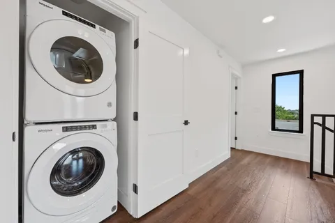 a view of a hallway with washer and dryer