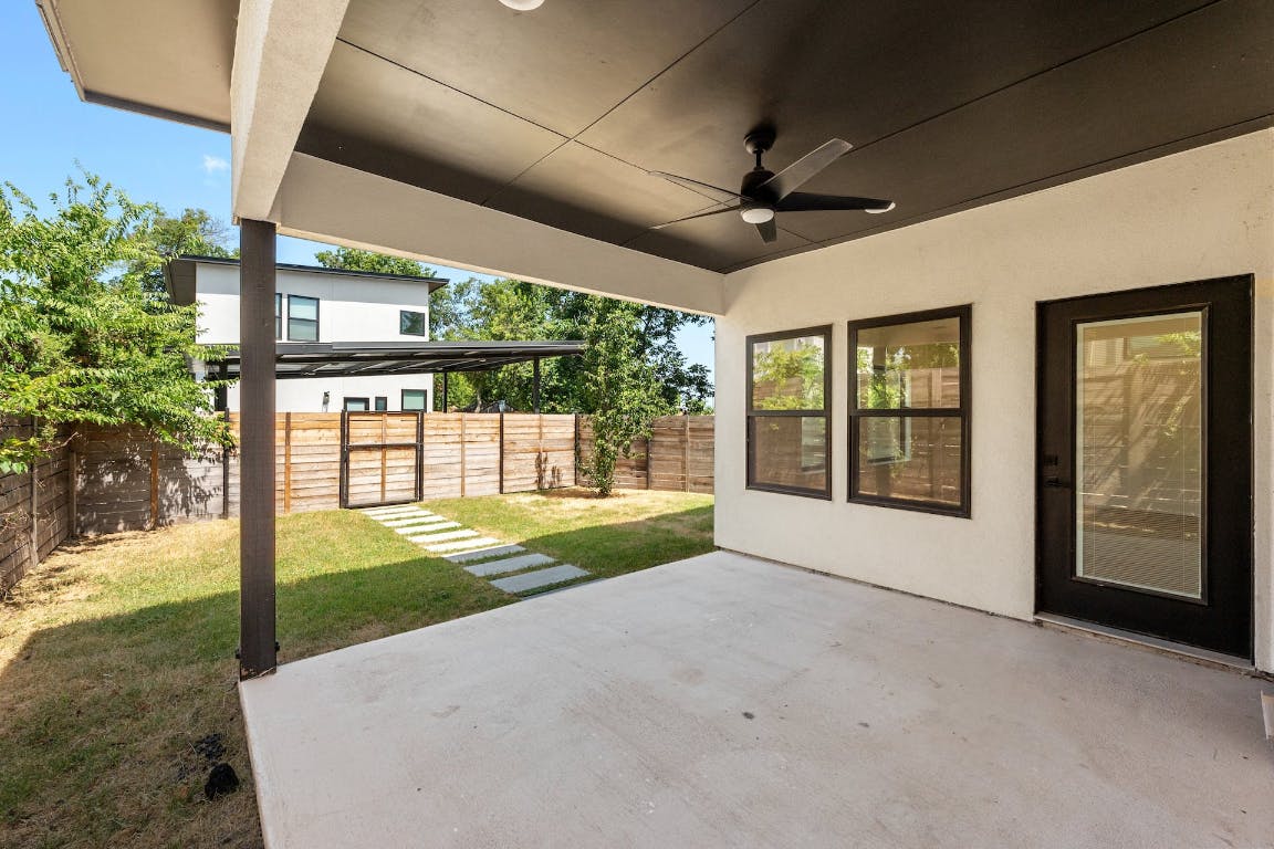 7008 Meador Avenue, Unit 1 Austin, TX 78752 - Photo 27 of 28 a view of a porch with furniture and garden