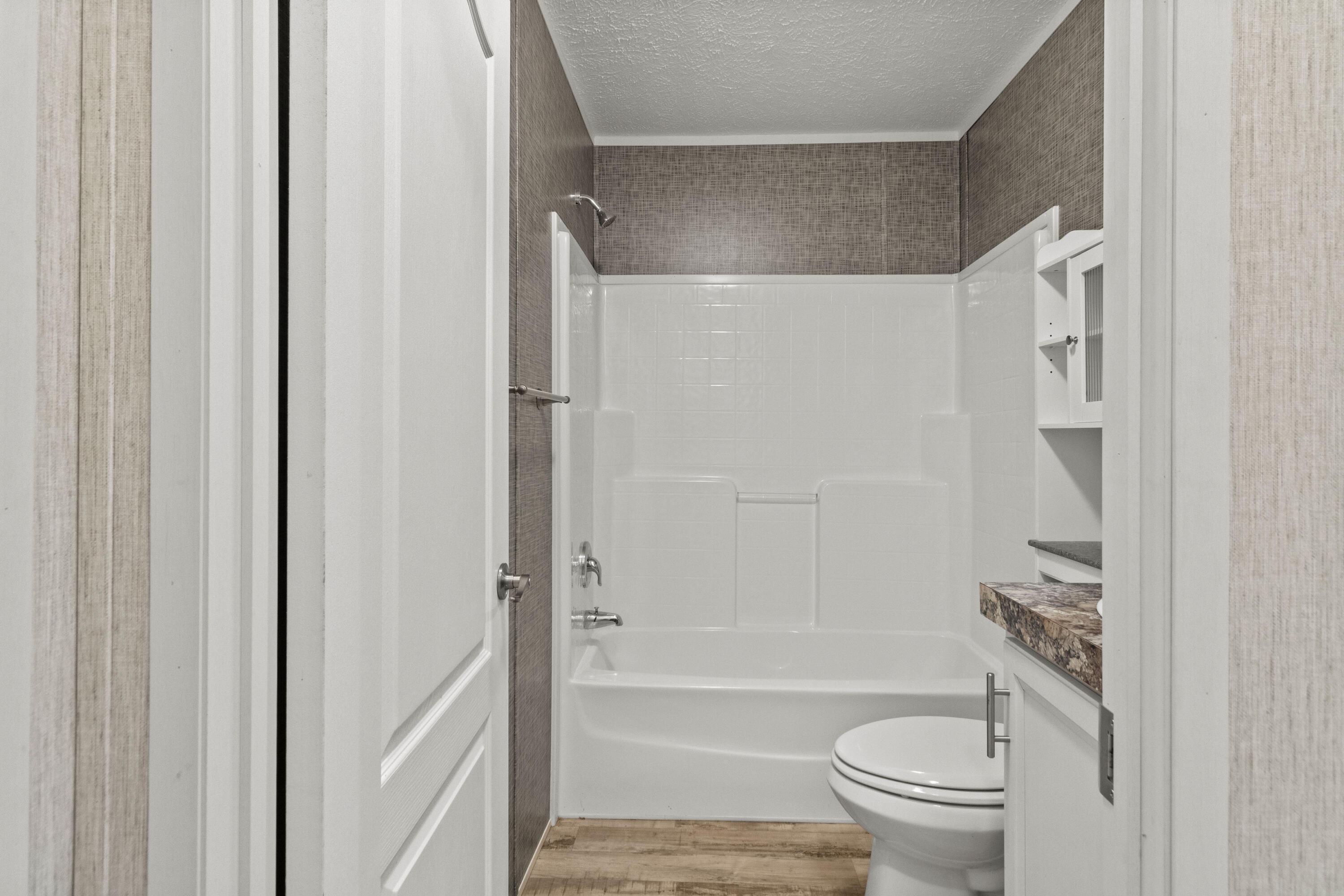 7419 Pappa Lawrence Road Laurel Hill, FL 32567 - Photo 28 of 40 a bathroom with a toilet and a bathtub