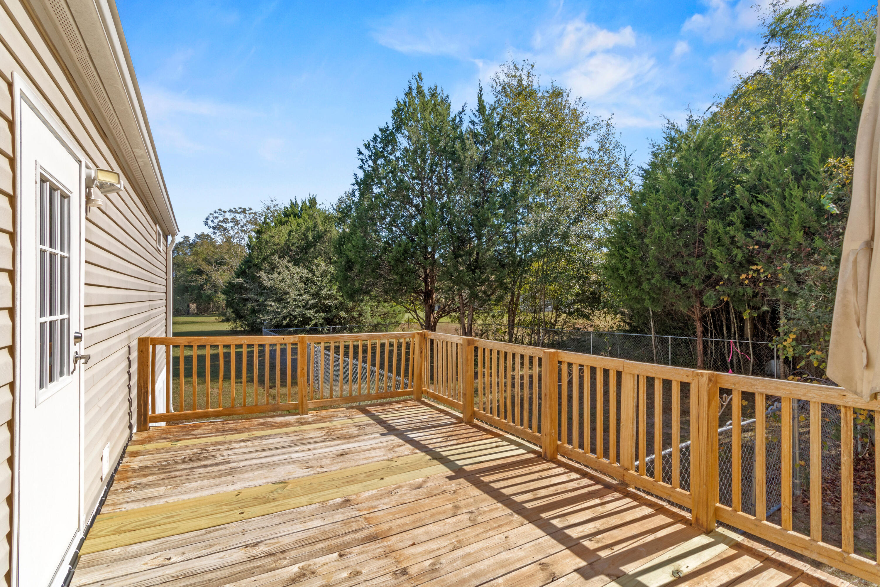 7419 Pappa Lawrence Road Laurel Hill, FL 32567 - Photo 32 of 40 a view of deck and backyard with wooden fence