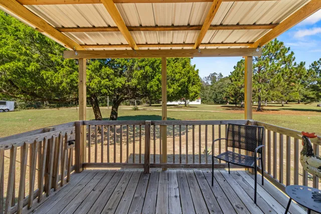 a view of a lake with a house in the background