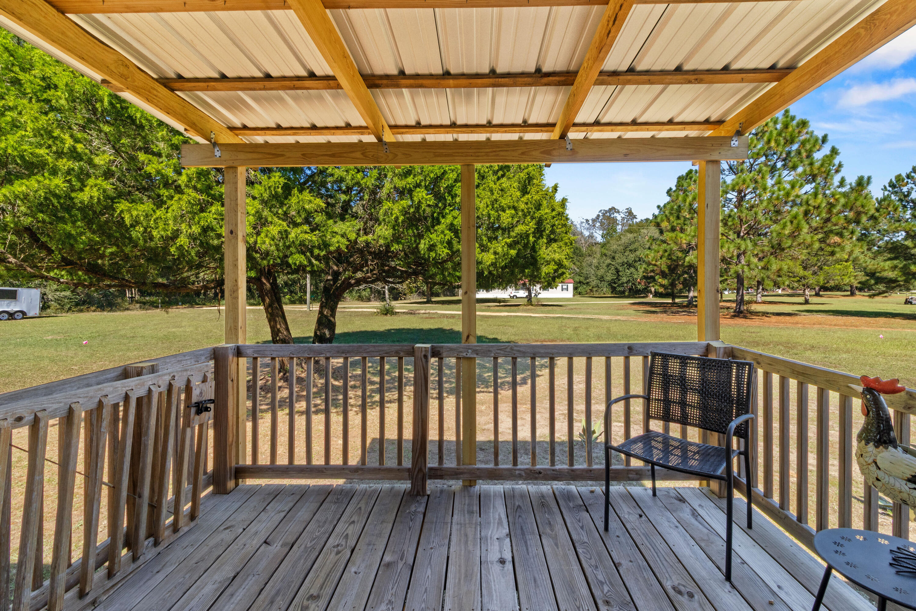 7419 Pappa Lawrence Road Laurel Hill, FL 32567 - Photo 33 of 40 a view of a wooden deck