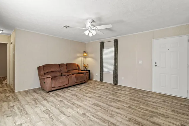 a kitchen with granite countertop a sink stove and refrigerator