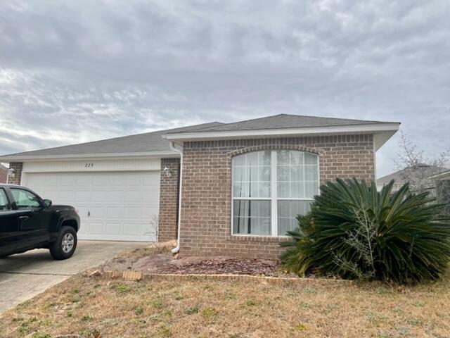 229 Limestone Circle Crestview, FL 32539 - Photo 1 of 22 a front view of a house with garden