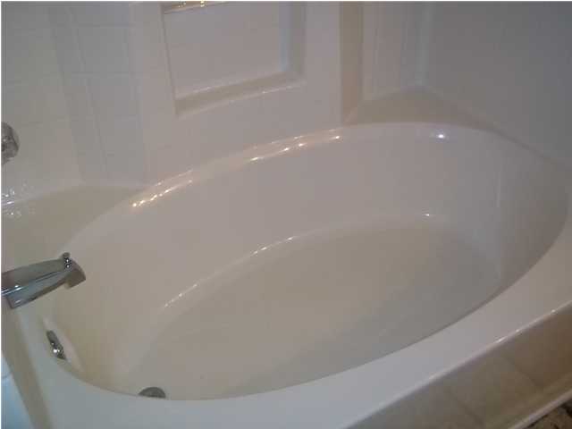 229 Limestone Circle Crestview, FL 32539 - Photo 12 of 22 a close up of a bathtub in a bathroom