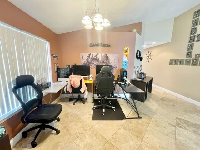 229 Limestone Circle Crestview, FL 32539 - Photo 2 of 22 a living room with furniture and a chandelier