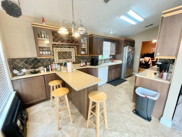 229 Limestone Circle Crestview, FL 32539 - Photo 4 of 22 a large kitchen with a table and chairs
