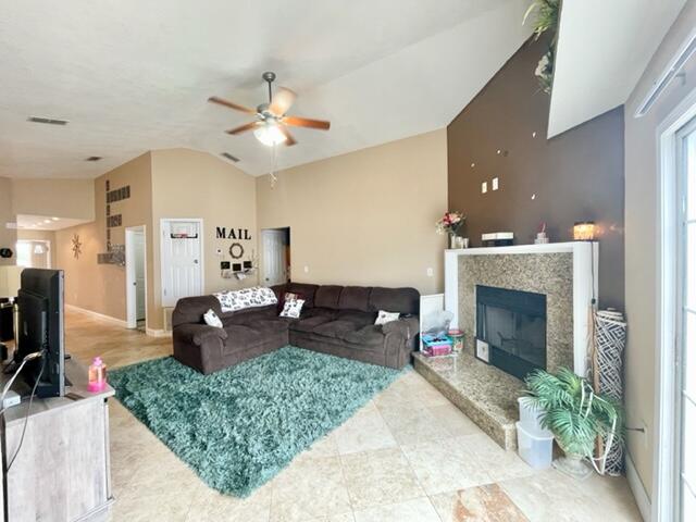 229 Limestone Circle Crestview, FL 32539 - Photo 5 of 22 a living room with furniture a fireplace and flat screen tv