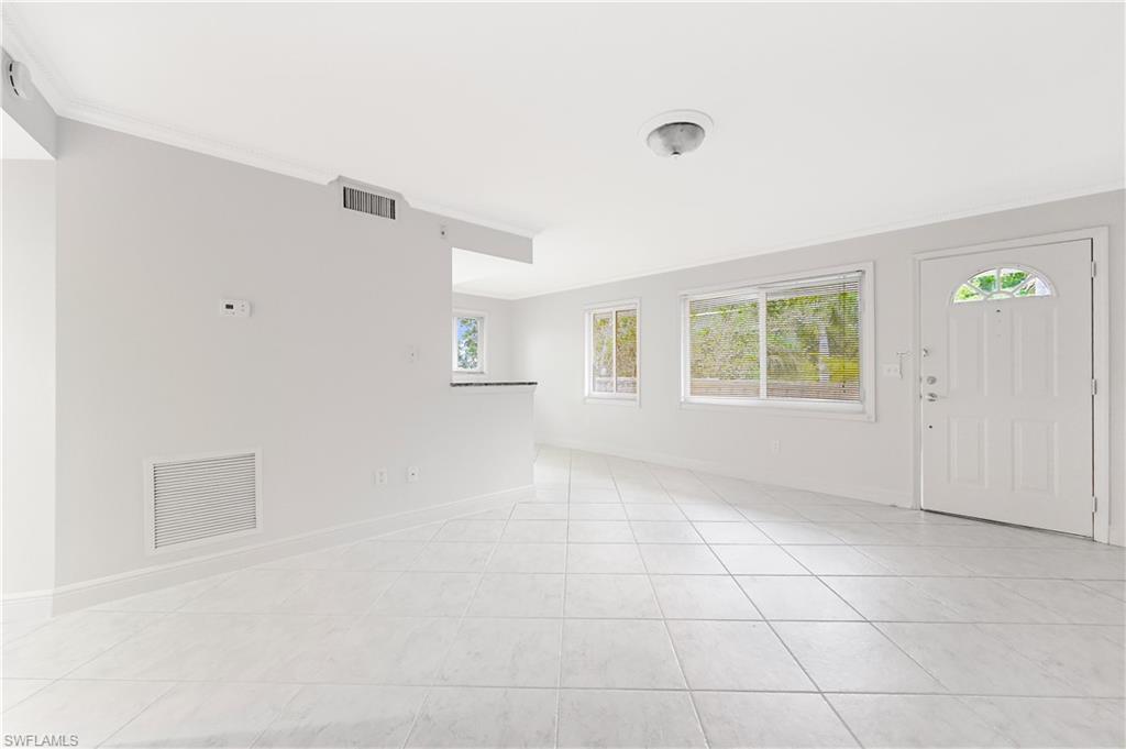 950 7th Avenue South, Unit 26 Naples, FL 34102 - Photo 3 of 15 a view of an empty room with a window